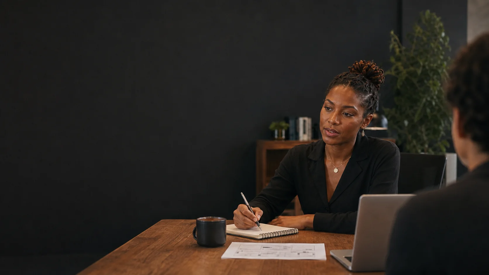 A Zyel strategist listening to a client during a working session.